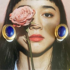 vintage MARVELLA gold tone clip on earrings with dark blue cabochon